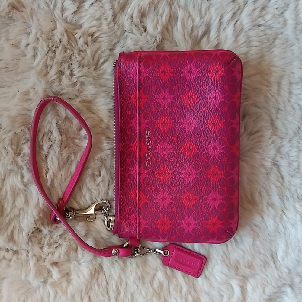Coach pink logo print wristlet.
